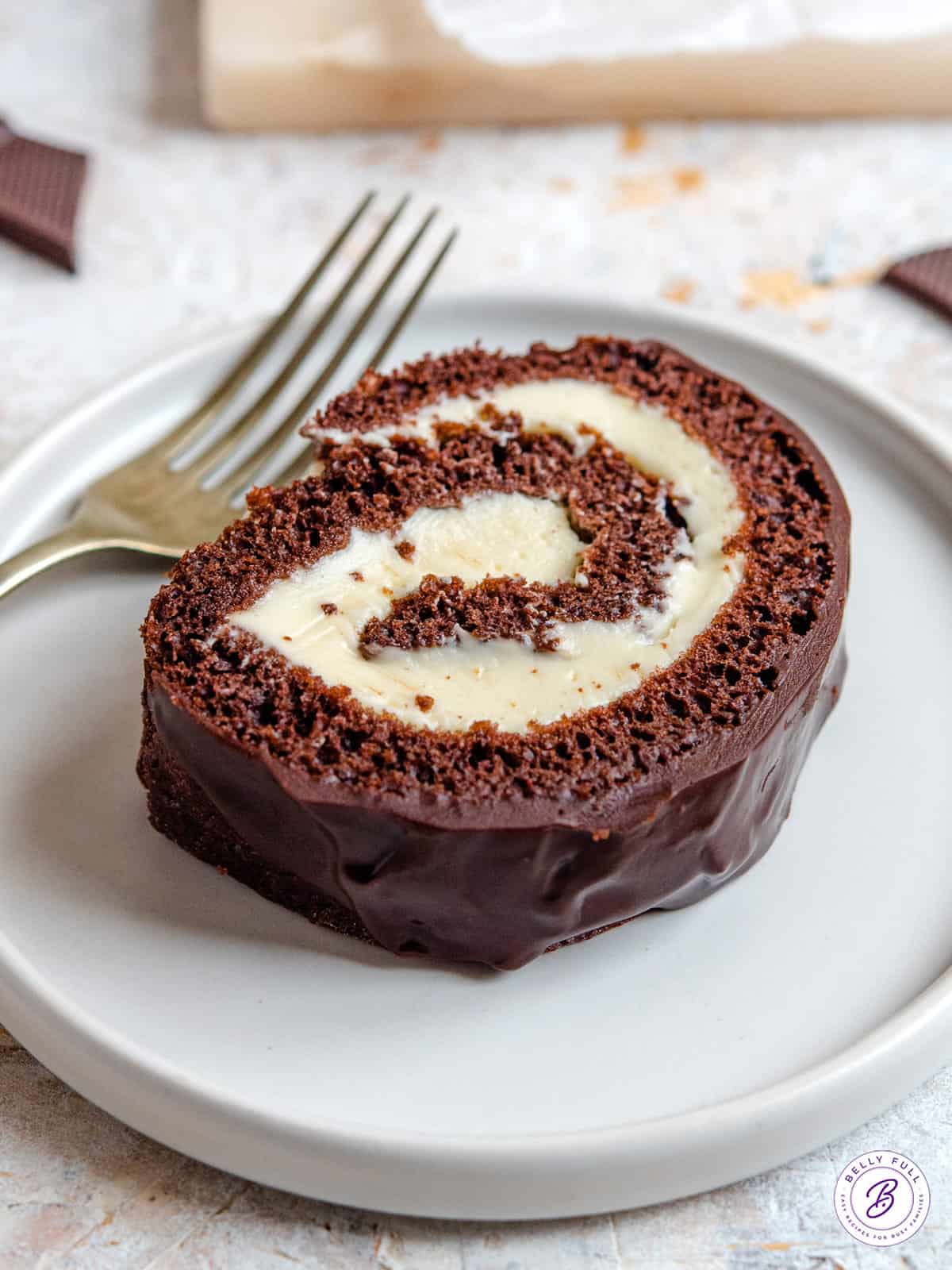 A covered bowl of chocolate mixture in the refrigerator.